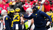 Michigan Wolverines head coach Sherrone Moore celebrates with defensive back Brandyn Hillman (6) in the first half of the NCAA football game at Michigan Stadium on Saturday, Nov. 29, 2025 in Ann Arbor, Michigan.