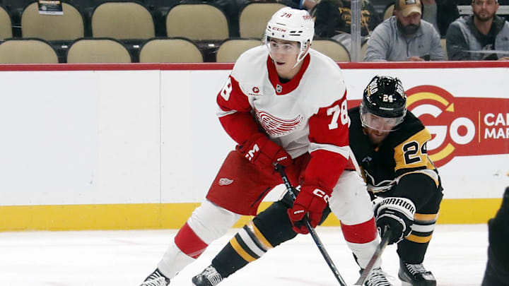 Oct 1, 2024; Pittsburgh, Pennsylvania, USA;  Detroit Red Wings center Amadeus Lombardi (78) skates in on goal against Pittsburgh Penguins defenseman Matt Grzelcyk (24) during the second period at PPG Paints Arena. Mandatory Credit: Charles LeClaire-Imagn Images