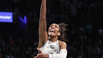 Oct 1, 2024; Brooklyn, New York, USA; Las Vegas Aces center A'ja Wilson (22) drives in for a layup in the second quarter against the New York Liberty during game two of the 2024 WNBA Semi-finals at Barclays Center. 