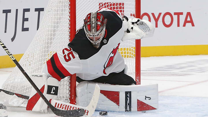 Oct 13, 2025; Columbus, Ohio, USA; New Jersey Devils goalie Jacob Markstrom (25) stops the shot from Columbus Blue Jackets center Sean Monahan (23) during the third period at Nationwide Arena. Mandatory Credit: Russell LaBounty-Imagn Images