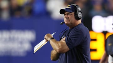 Oct 3, 2025; Provo, Utah, USA; West Virginia Mountaineers head coach Rich Rodriguez looks on during the first quarter of the game against the Brigham Young Cougars at LaVell Edwards Stadium. Mandatory Credit: Rob Gray-Imagn Images