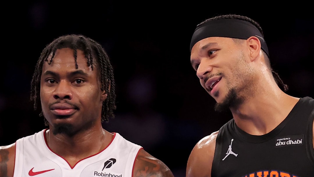 New York Knicks guard Josh Hart talks to Miami Heat guard Davion Mitchell.