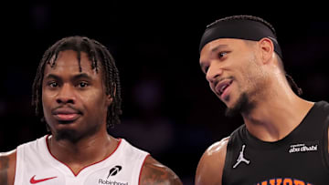 New York Knicks guard Josh Hart talks to Miami Heat guard Davion Mitchell.