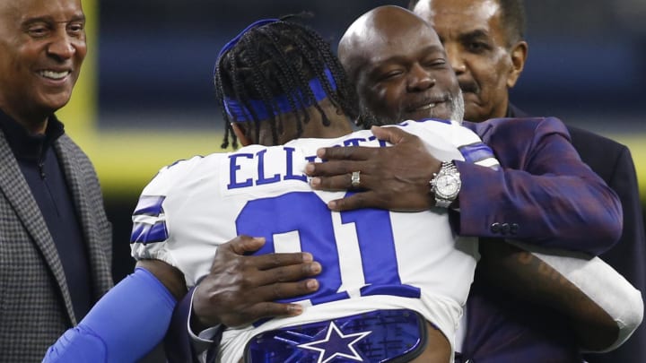 Nov 28, 2019; Arlington, TX, USA; Dallas Cowboys running back Ezekiel Elliott (21) hugs former Dallas Cowboys Emmitt Smith before the game against the Buffalo Bills at AT&T Stadium. 