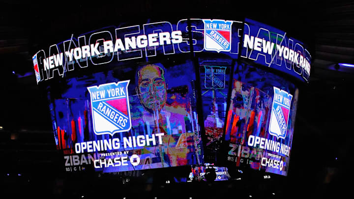 Jan 14, 2021; New York, NY, USA;  New York Rangers players huddle around the center ice logo as they prepare for the home opener against the New York Islanders at Madison Square Garden.
