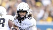 Nov 8, 2025; Morgantown, West Virginia, USA; Colorado Buffaloes quarterback Julian Lewis (10) runs out of the pocket during the third quarter against the West Virginia Mountaineers at Milan Puskar Stadium.