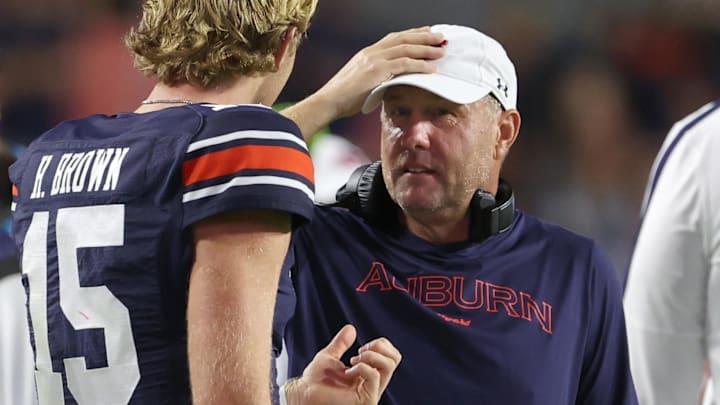 Auburn Tigers head coach Hugh Freeze talks with quarterback Hank Brown (15) during the fourth quarter against the New Mexico Lobos at Jordan-Hare Stadium.