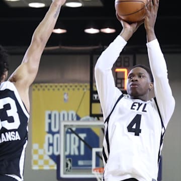 Feb 18, 2024; Indianapolis, Indiana, USA; Team ELY forward Babacar Sane (4) of the G League Ignite shoots the ball over Team BallIsLife forward Izan Almansa (33) G League Ignite during the G-League Next Up game at Indiana Convention Center. Mandatory Credit: Trevor Ruszkowski-Imagn Images