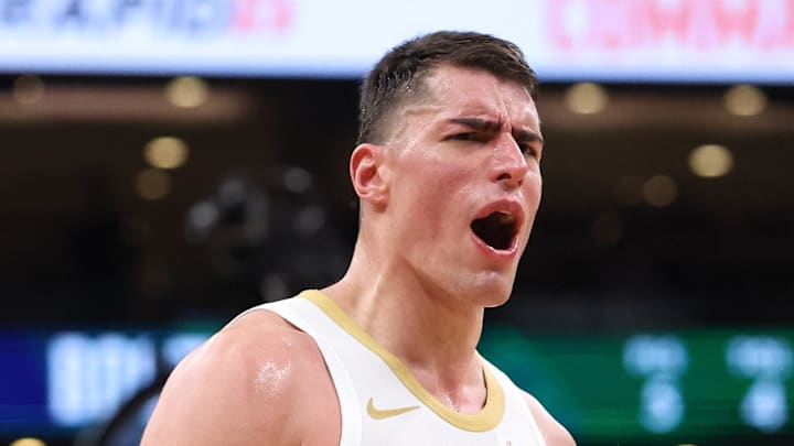 Apr 12, 2026; Boston, Massachusetts, USA; Boston Celtics forward Luka Garza (52) reacts during the second half against the Orlando Magic at TD Garden. Mandatory Credit: Paul Rutherford-Imagn Images