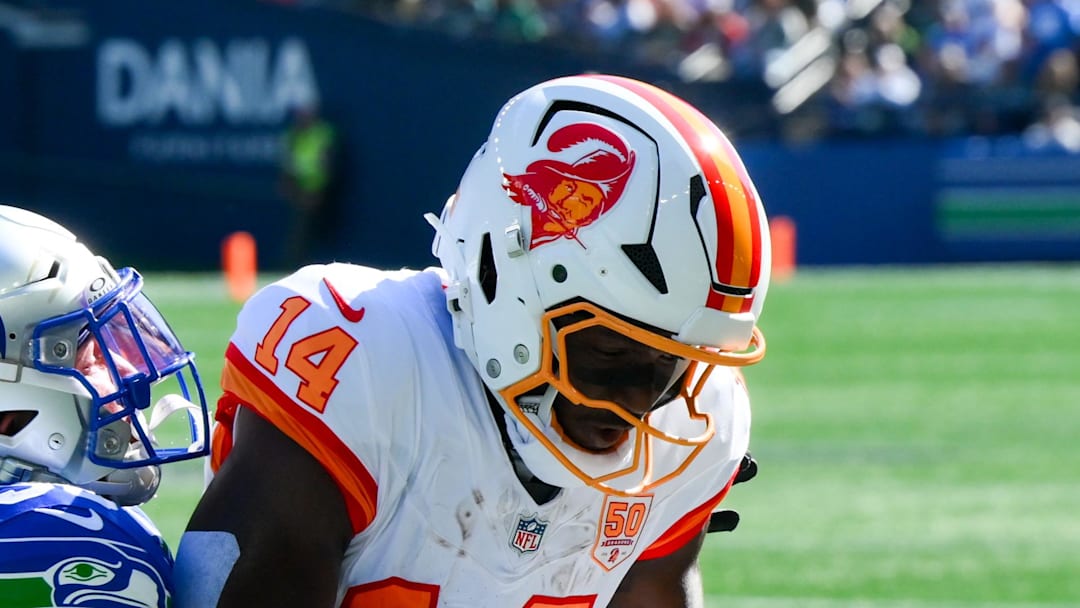 Seattle Seahawks safety Ty Okada breaks up a pass to Tampa Bay Buccaneers wide receiver Chris Godwin.