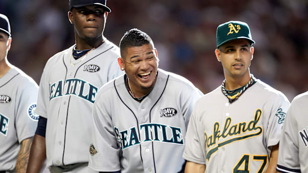 Mariners pitcher Felix Hernandez, center, laughs during All-Star Game introductions