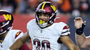 Sep 23, 2024; Cincinnati, Ohio, USA; Washington Commanders running back Austin Ekeler (30) celebrates his touchdown with quarterback Jayden Daniels (left) and center Tyler Biadasz (63) during the first quarter against the Cincinnati Bengals at Paycor Stadium. Mandatory Credit: Joseph Maiorana-Imagn Images
