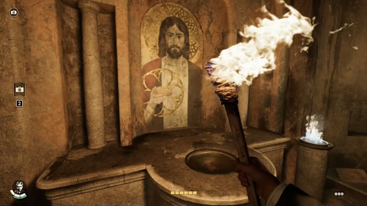 Indiana holding a torch and looking at a painting of Jesus with his right hand circled and the roman numeral for 2 in wine.