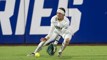 May 30, 2025; Oklahoma City, OK, USA;  Oregon Ducks outfielder Kedre Luschar (1) fields the ball in the sixth inning against the Ole Miss Rebels during the NCAA Softball Women's College World Series at Devon Park. Mandatory Credit: Brett Rojo-Imagn Images