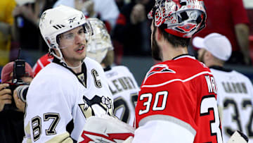 May 26, 2009; Raleigh, NC, USA; Pittsburgh Penguins center Sidney Crosby (87) and Carolina Hurricanes goalie Cam Ward (30) shake hands after the game four of the eastern conference finals of the 2009 Stanley Cup playoffs at the RBC Center. The Penguins defeated the Hurricanes 4-1 to advance to the Stanley Cup finals. Mandatory Credit: James Guillory-Imagn Images