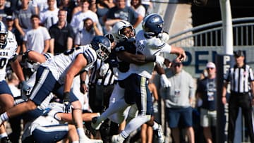 Penn State's Dani Dennis-Sutton hits Nevada quarterback Chubba Purdy in the first half of an NCAA football game against Nevada, Saturday, August 30, 2025, in State College, Pa.