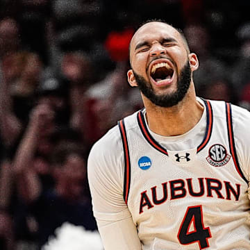 Auburn forward Johni Broome celebrates a play.