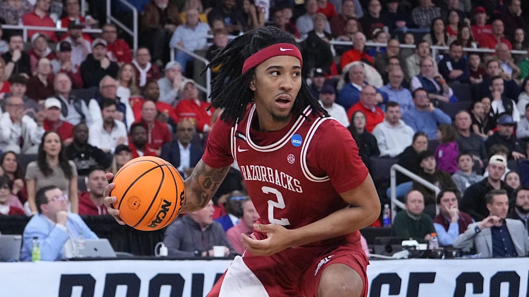 Mar 22, 2025; Providence, RI, USA; Arkansas Razorbacks guard Boogie Fland (2) dribbles against St. John's Red Storm guard Aaron Scott (0) during the second half of a second round men’s NCAA Tournament game at Amica Mutual Pavilion. Mandatory Credit: Gregory Fisher-Imagn Images