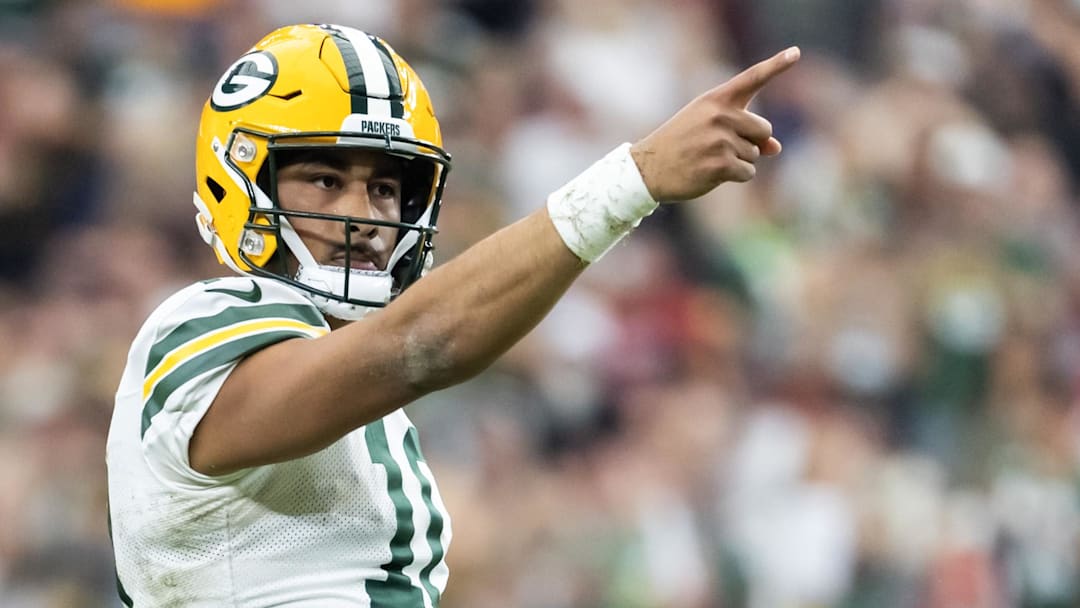 Green Bay Packers quarterback Jordan Love (10) celebrates a first down against the Arizona Cardinals in the second half at State Farm Stadium. Green Bay Packers quarterback Jordan Love (10) celebrates a first down against the Arizona Cardinals in the second half at State Farm Stadium.
