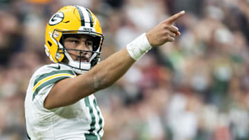 Green Bay Packers quarterback Jordan Love (10) celebrates a first down against the Arizona Cardinals in the second half at State Farm Stadium.