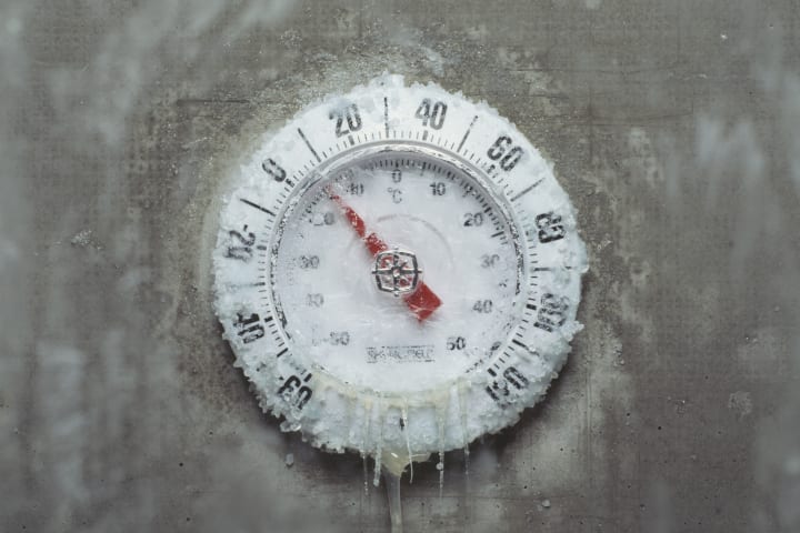 An iced over thermometer.