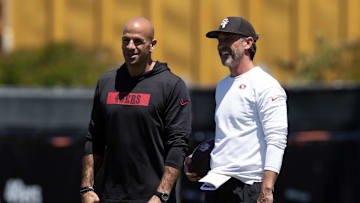 May 9, 2025; Santa Clara, CA, USA; San Francisco 49ers head coach Kyle Shanahan, right, confers with defensive coordinator Robert Saleh during the teamís rookie minicamp. Mandatory Credit: D. Ross Cameron-Imagn Images