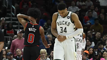 Feb 16, 2023; Chicago, Illinois, USA;  Milwaukee Bucks forward Giannis Antetokounmpo (34) holds his wrist after colliding with Chicago Bulls guard Coby White (0) during the first half at the United Center. Mandatory Credit: Matt Marton-Imagn Images