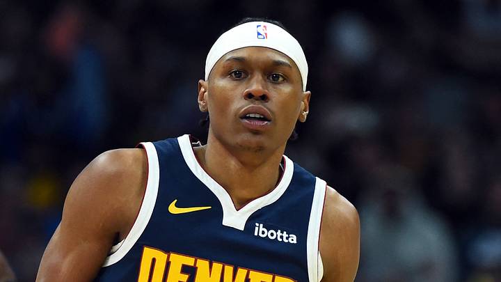 Former Denver Nuggets forward Peyton Watson (8) looks on