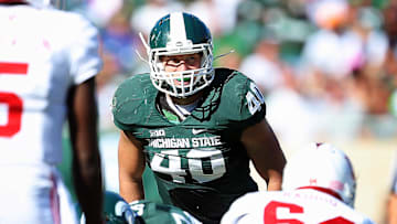 Oct 12, 2013; East Lansing, MI, USA; Michigan State Spartans linebacker Max Bullough (40) looks over Indiana Hoosiers offense during the second half in a game at Spartan Stadium. MSU won 42-28. Mandatory Credit: Mike Carter-Imagn Images