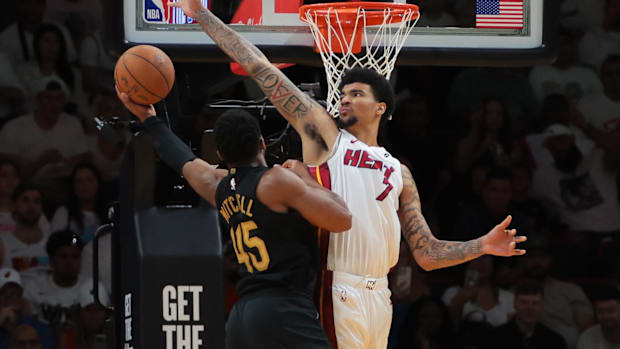 Donovan Mitchell (45) drives to the basket against Miami Heat center Kel'el Ware (7)