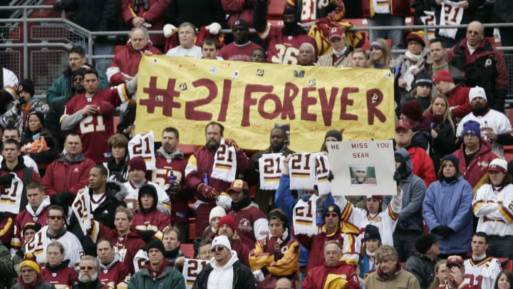 Dec 2, 2007; Landover, MD, USA; Washington Redskins fans hold up a sign dedicated to Washington Redskins safety Sean Taylor during the game against the Buffalo Bills at FedEx Field in Landover, MD. Taylor died on 11/27/07 from a gunshot wound he suffered during a burglary attempt of his home the day before. Mandatory Credit: James Lang USA TODAY Sports