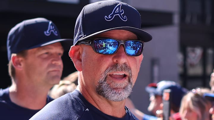 Mar 27, 2026; Atlanta, Georgia, USA; Atlanta Braves manager Walt Weiss (4) walks in a parade before a game against the Kansas City Royals on opening day at Truist Park.
