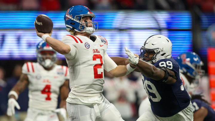 Dec 30, 2023; Atlanta, GA, USA; Mississippi Rebels quarterback Jaxson Dart (2) is pressured by Penn State Nittany Lions defensive tackle Coziah Izzard (99) in the first quarter at Mercedes-Benz Stadium. Mandatory Credit: Brett Davis-USA TODAY Sports