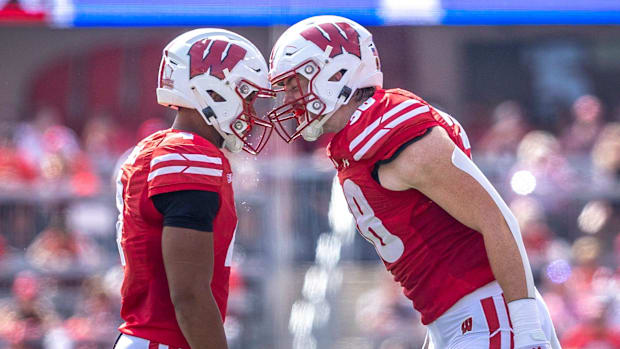 Wisconsin Badgers C.J. Williams (4) and Tawee Walker (3) headbutt at the end of a timeout 