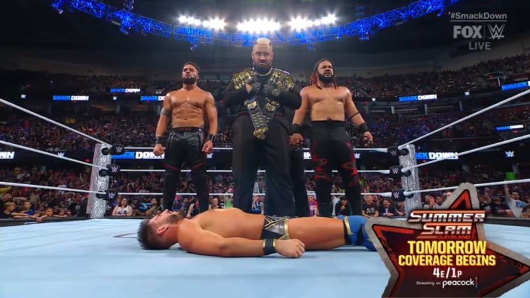 The Bloodline stand tall over Johnny Gargano after capturing the WWE Tag Team Championship one night before SummerSlam 2024.