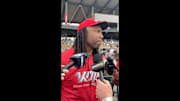 Larry Fitzgerald speaks with reporters.