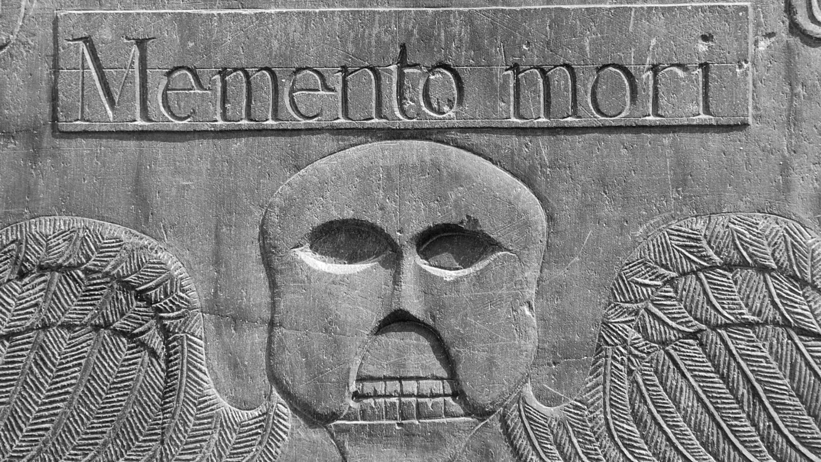 The Hidden Meaning Behind Winged Skulls on Old Gravestones