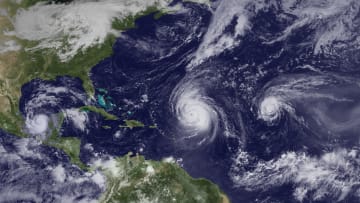 The busy 2010 Atlantic hurricane season shows Hurricane Karl west of the Yucatan Peninsula, Hurricane Igor east of Puerto Rico, and Hurricane Julia in mid-Atlantic.