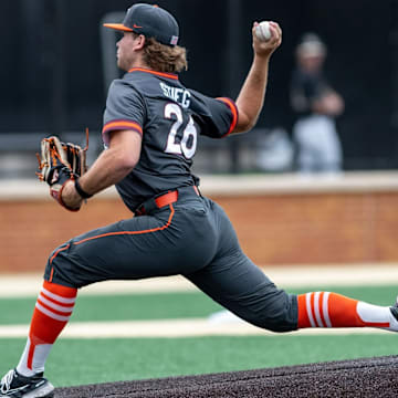 Griffin Stieg delivers the pitch in the gray Hokies jerseys.