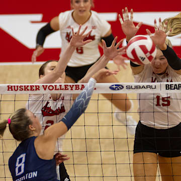 Nebraska's Bergen Reilly and Andi Jackson work to block a Creighton attack.