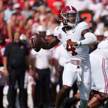 Sep 14, 2024; Madison, Wisconsin, USA; Alabama Crimson Tide quarterback Jalen Milroe (4) throws a pass during the first quarter against the Wisconsin Badgers at Camp Randall Stadium. 