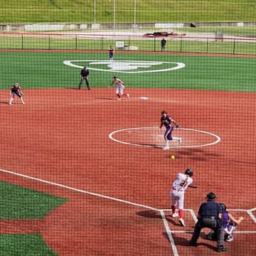 Caylee Ortiz of Canfield connects on a three-run double in the 2024 OHSAA Division II state championship game against Bryan on June 1, 2024.