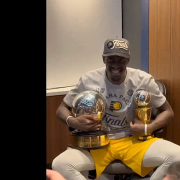 Pascal Siakam holds two trophies while celebrating Pacers’ win in Eastern Conference finals.