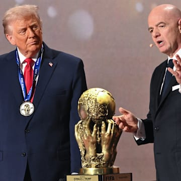 Donald Trump (left) was the first recipient of the FIFA Peace Prize drawn up by Gianni Infantino.