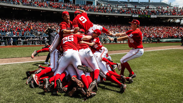 Nebraska baseball players dog pile on the field after winning the 2024 Big Ten Conference Tournament Championship game.