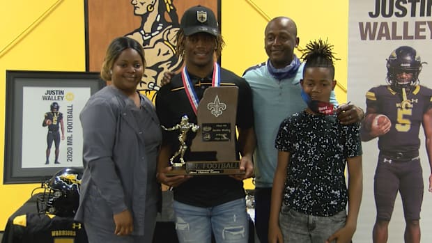 Justin Walley of D'Iberville High School receives the trophy for 6A Mississippi Mr. Football after the 2020 season.