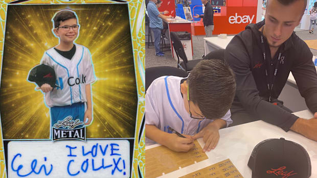 Eli Bloom signing his Leaf Trading Card autographs 