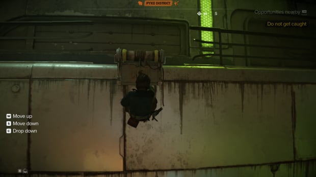 Star Wars Outlaws gameplay: Kay grappling down a wall.