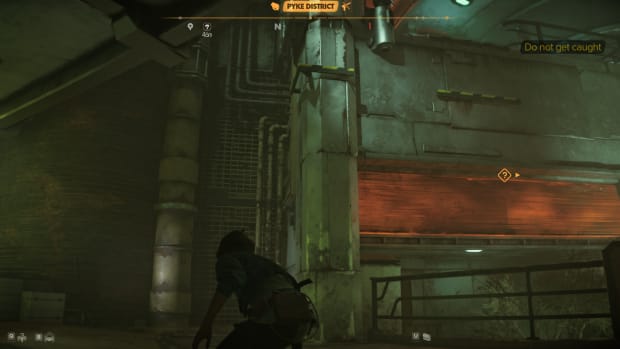 Star Wars Outlaws gameplay: Kay sneaking towards a grate on a wall that she can climb up.