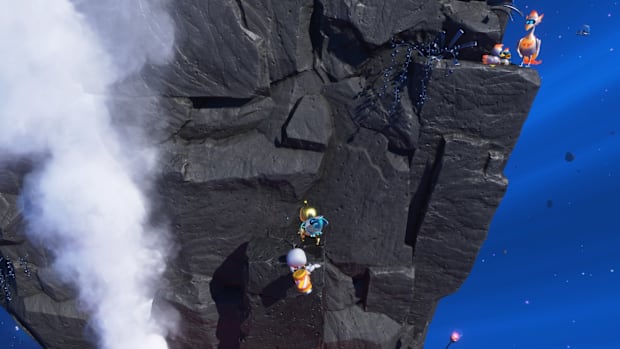 A bot hanging from the edge of a cliff in Astro Bot's High Suction Hero level.